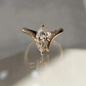 Macro shot of marquise-cut sparkling zircon on elegant s925 silver wedding ring