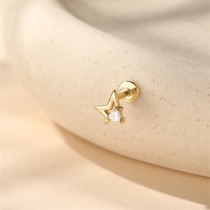 Macro shot of 16G gold star flat back stud with heart zircon and S925 silver stamp