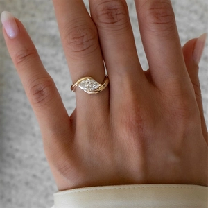 Detailed view of s925 silver marquise cut zircon ring with elegant crisscross gold finish