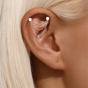 Detail of S925 sterling silver multi-layer chain cartilage earring on model ear