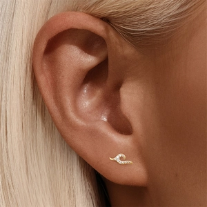 Detailed close-up of a s925 silver wave-shaped stud earring with inlaid white zircons