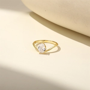 Close-up of S925 sterling silver stamp and pear-cut zircon on gold-plated ring