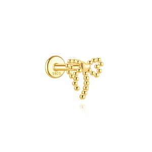 Macro detail of golden bow cartilage stud earring with S925 silver hallmark engraving