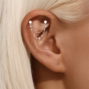 Detail of S925 sterling silver triple layer chain earring with beads on model ear