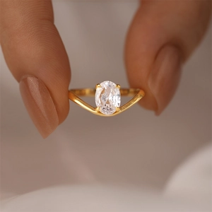 Macro shot of s925 silver ring with a large oval zircon in a four-prong gold setting