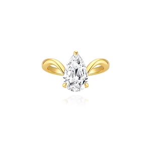 Macro view of pear-cut zircon on a golden curved silver band with elegant reflections