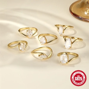 Set of seven S925 sterling silver gold rings with various geometric zircon cuts