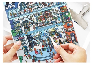Macro detail of large 2.5D scenery stickers showing busy airport scene with tiny figures
