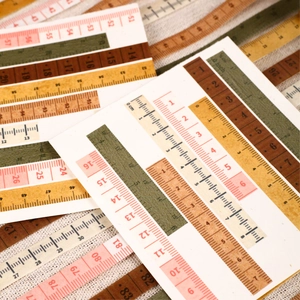 Vintage style paper measuring tape stickers with cm and inch scales for DIY journaling