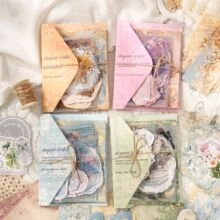 Close-up of vintage PET stickers with watercolor roses and hemp rope for DIY journaling