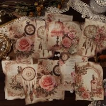 Detail of vintage PET stickers featuring roses, clocks, and lace for scrapbooking crafts