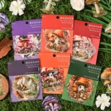 Detail of vintage mushroom house PET stickers on natural moss for scrapbooking