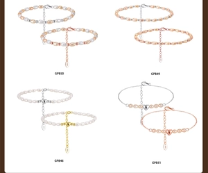 Detalle del collar de plata S925 con perlas, estrella de mar y colgante de corazón