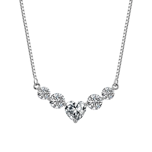 Macro shot of 925 silver necklace featuring a heart-shaped moissanite center stone