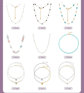 Collection of heart and cross necklaces featuring beads, pearls, and gold-plated chains