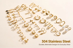 Flat lay of gold plated 304 stainless steel earrings in clover and geometric shapes