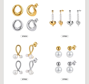 Detail showcasing variety of heart and pearl drop earrings in gold and silver finish