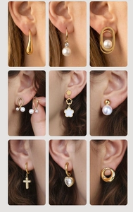 Close-up of diverse gold stainless steel earrings set with pearls and zircons