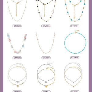 Collection of stainless steel necklaces featuring bead chains, heart and cross pendants