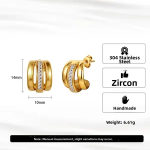 Gold-plated C-shaped stainless steel earrings with hollow triple-ring design and cubic zirconia