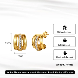 Detail of C-shaped gold stainless steel earrings with cubic zirconia and 14mm height dimension