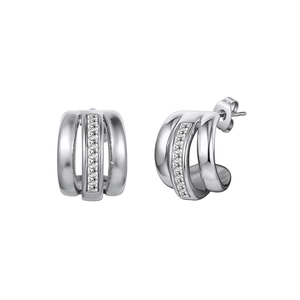 Close-up of C-shaped silver earrings with three rows of polished steel and cubic zirconia