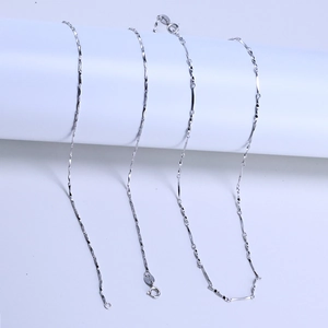 Close-up of 1.0mm S925 sterling silver twisted link chain showing fine texture