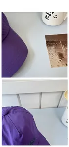Détail de casquette de baseball violette à séchage rapide avec broderie Nature et coutures