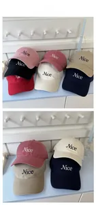 Detailed tile display of various multi-colored cotton baseball caps with Nice embroidery