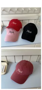 Detailed view of nice embroidery on cotton baseball caps in multiple colors