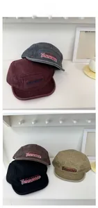Close-up of vintage five-panel caps with premium Tennessee embroidery in multi-colors