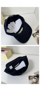 Detail of navy cotton baseball cap showing interior structure and adjustable metal buckle