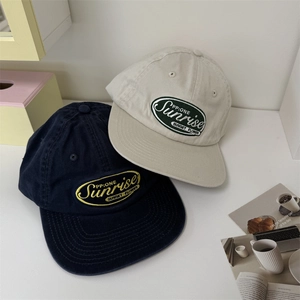 Flat brim navy and beige cotton baseball caps with oval sunrise flower embroidery