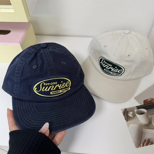 Classic embroidered navy and beige cotton baseball caps in a soft top casual style