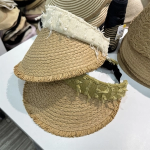 Women's summer straw visor hats with frayed edges and wide brims for beach sun protection