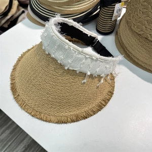 Women's straw top sun hat with wide frayed brim and white textured fabric band