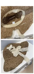 Detailed interior view of a paper straw hat with white lace bow and 100% paper label