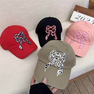 Bowknot snake embroidery cotton baseball caps in red, black, pink, and khaki colors