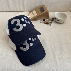 Retro contrast color baseball cap with silver embroidered number 3 and cotton fabric texture