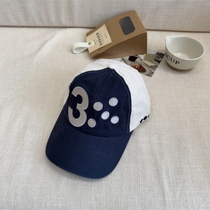 Retro two-tone navy and white baseball cap with number 3 embroidery and curved brim
