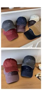 Detail showing various colors of embroidered cotton baseball caps with Lucy lettering
