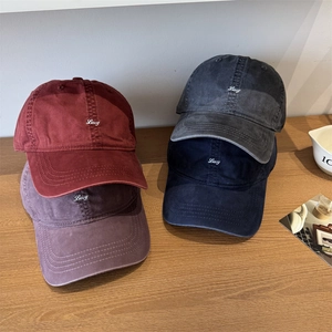 Vintage washed cotton baseball caps with Lucy embroidery in burgundy, grey, and navy colors