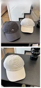 Close-up of embroidered logo on quick-dry baseball caps with ripstop nylon texture