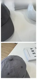 Detailed macro view of lightweight gray running cap with fine stitching and side embroidery