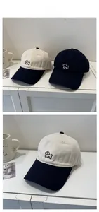 Close-up of cute dog animal embroidery on a soft washed cotton baseball cap brim