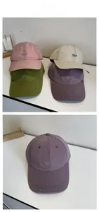 Detail showing various colors and embroidered Nice logo on quick-dry grid baseball caps