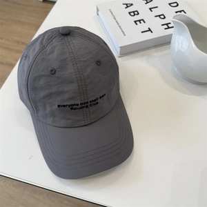 Dark grey quick-dry waterproof baseball cap with Running Club embroidery on white table