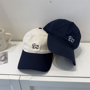 Adjustable cotton baseball cap with cute dog embroidery in navy and beige colors