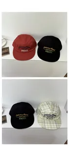 Detailed tile display of five-panel caps in red, black and checkered streetwear patterns