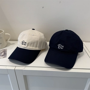 Washed cotton baseball cap featuring minimalist cute dog embroidery in navy and beige